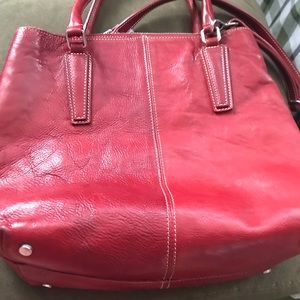 Beautiful large red leather bag.